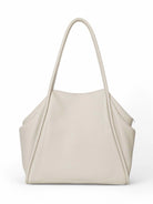 Off-white tote bag with two top handles.  Textured, slightly pebbled leather-like material.