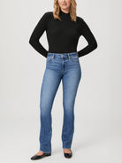 Paige Manhattan Boot jeans; light-wash denim, straight leg, slightly flared at the bottom.