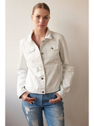 Off-white leather jacket, button front, two chest pockets.  Silver buttons.