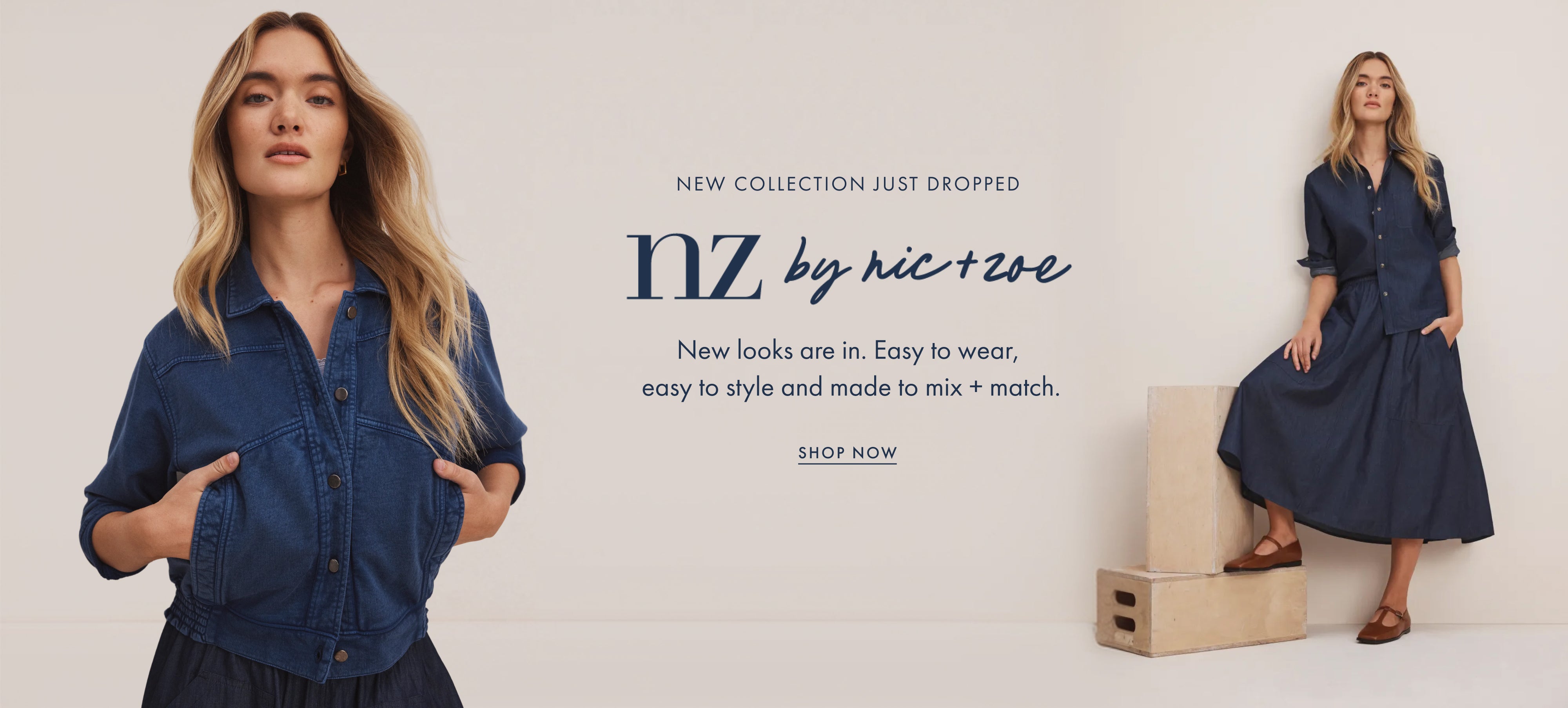 A fashion promotional banner featuring a model wearing a dark blue denim shirt-jacket and matching dark dress on the left, and a full-length view of the same model wearing a matching dark blue midi dress standing on wooden blocks on the right. Text in the center reads 'NEW COLLECTION JUST DROPPED nz by nic+ze' with a 'SHOP NOW' link.