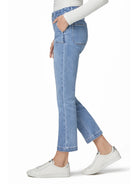 Light blue straight ankle jeans with prominent patch front pockets and a finished hem, worn on a model.