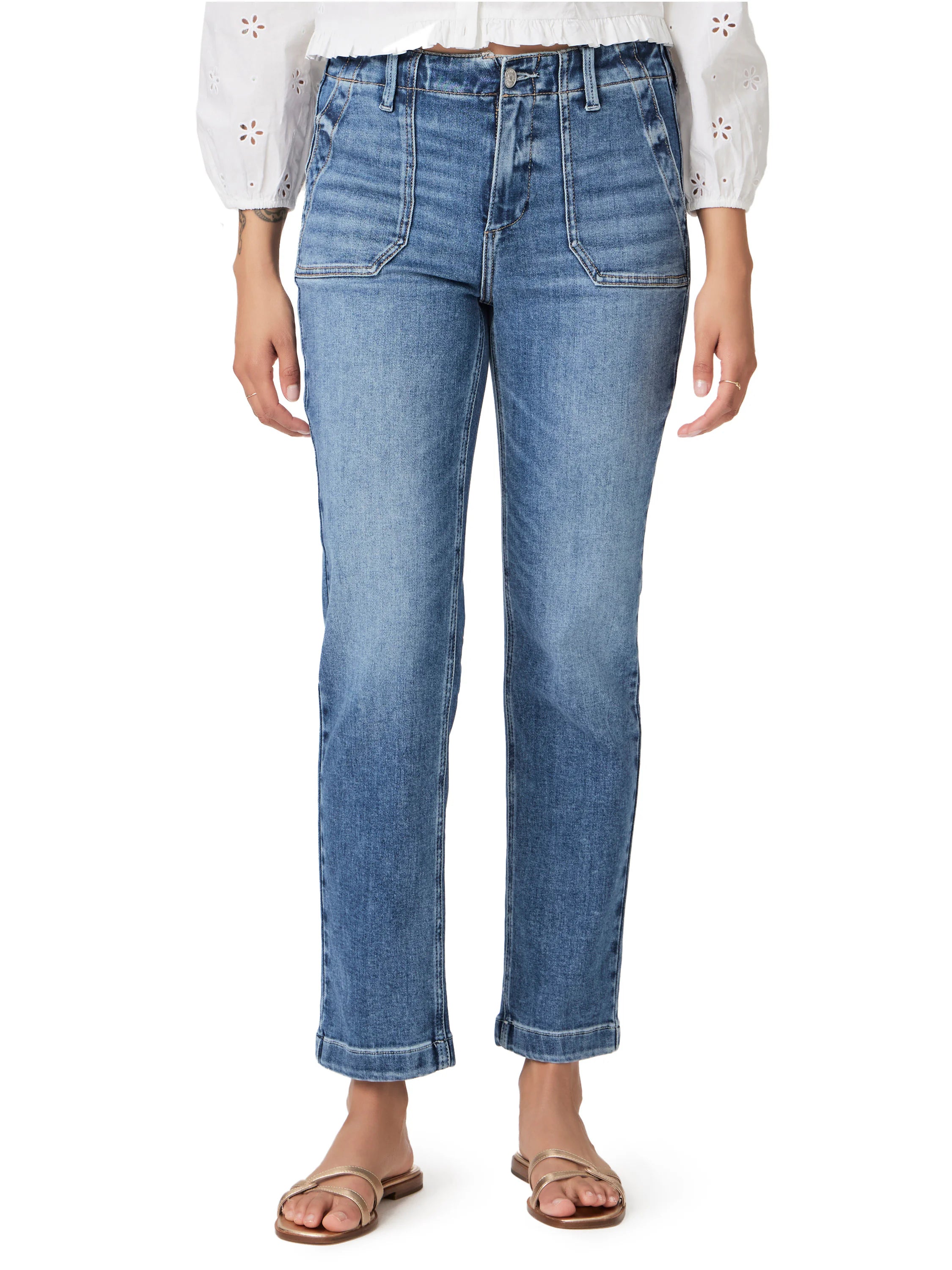 Medium blue wash straight ankle jeans with distinct front patch pockets and cuffed hems.