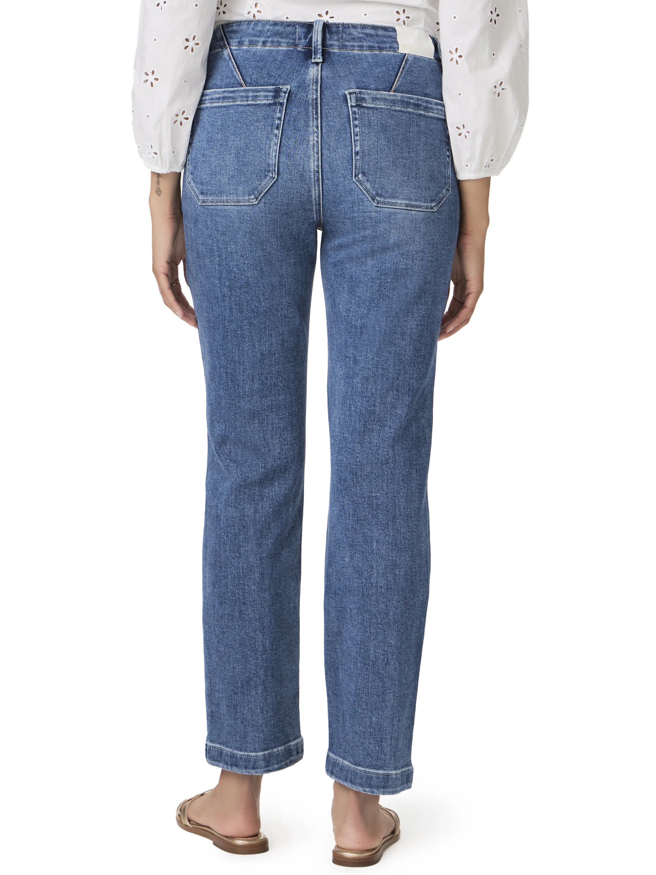 Back view of medium blue straight ankle jeans with a V-yoke and angular patch back pockets.