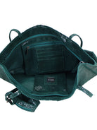 Dark teal snakeskin tote bag; open, showing green interior, zippered pockets.