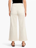 Off-white, wide-leg cropped jeans; back view.  Features include back pockets and a visible waistband.