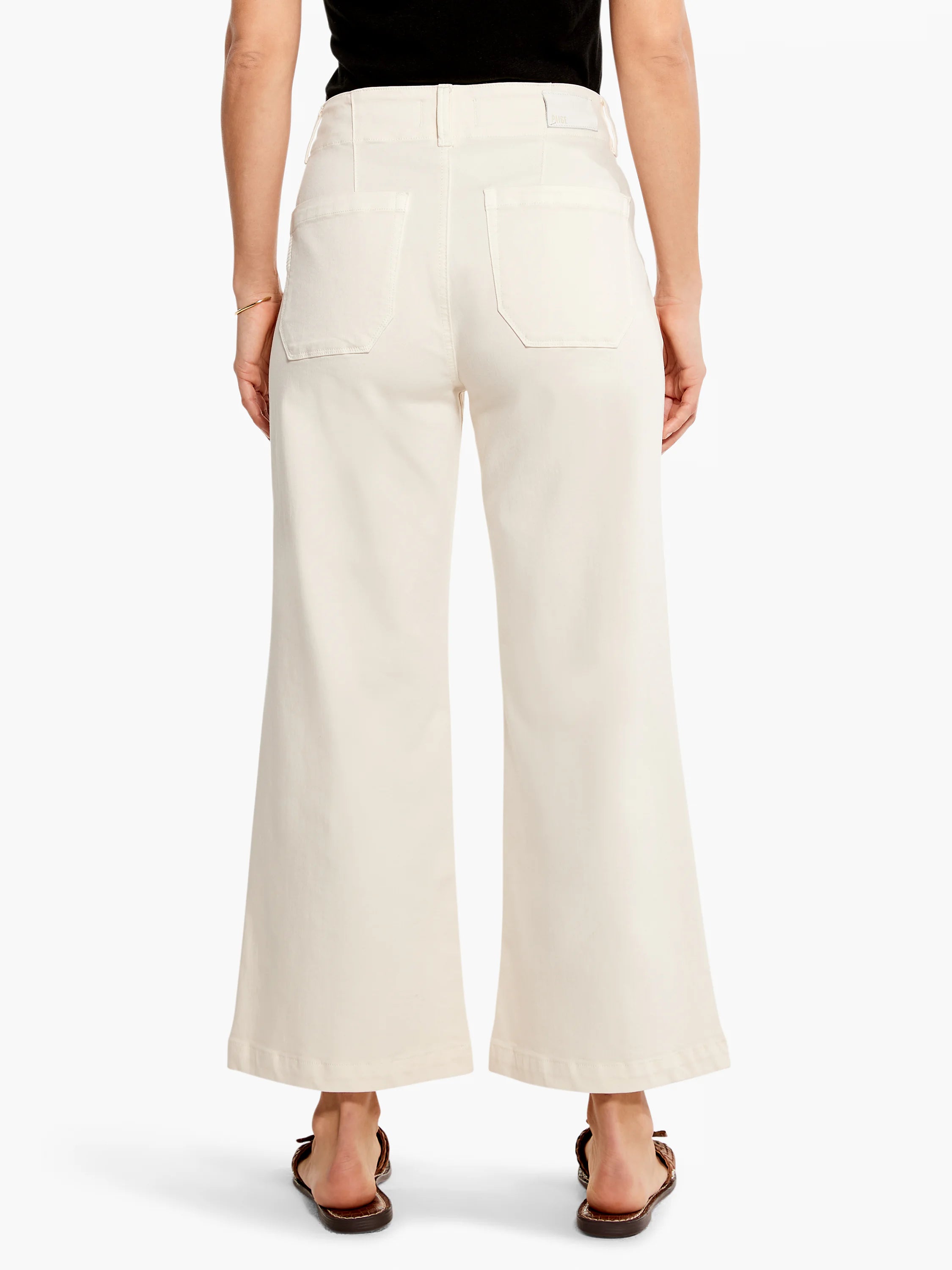 Off-white, wide-leg cropped jeans; back view.  Features include back pockets and a visible waistband.