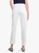 White cargo pants, cropped.  Features multiple pockets.  Model wears light blue sandals.