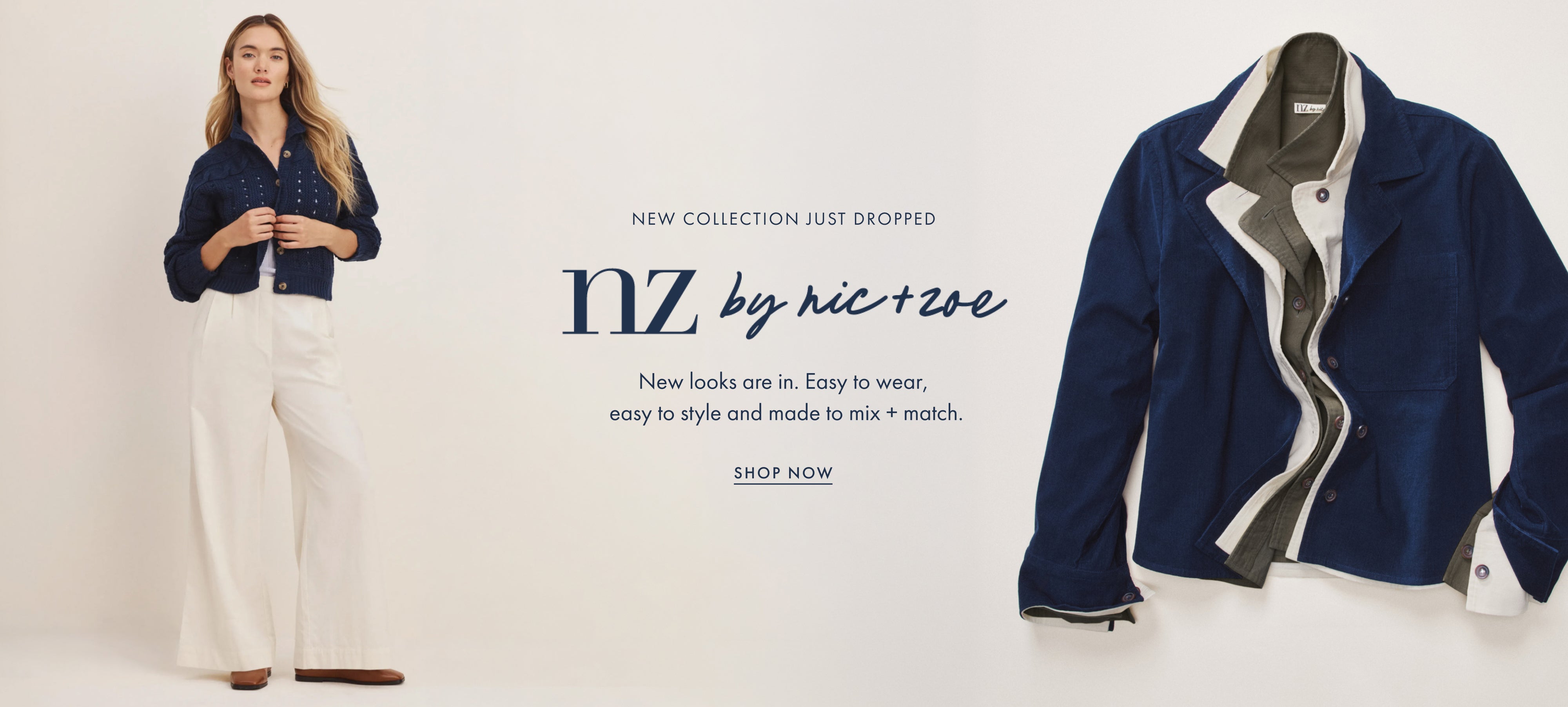A promotional banner for 'nz by nic+te' showing a model on the left in a navy blue jacket and white trousers, and a close-up of the navy blue jacket with a gray and white interior lining on the right. Text reads 'NEW COLLECTION JUST DROPPED nz by nic+te' and 'SHOP NOW'.