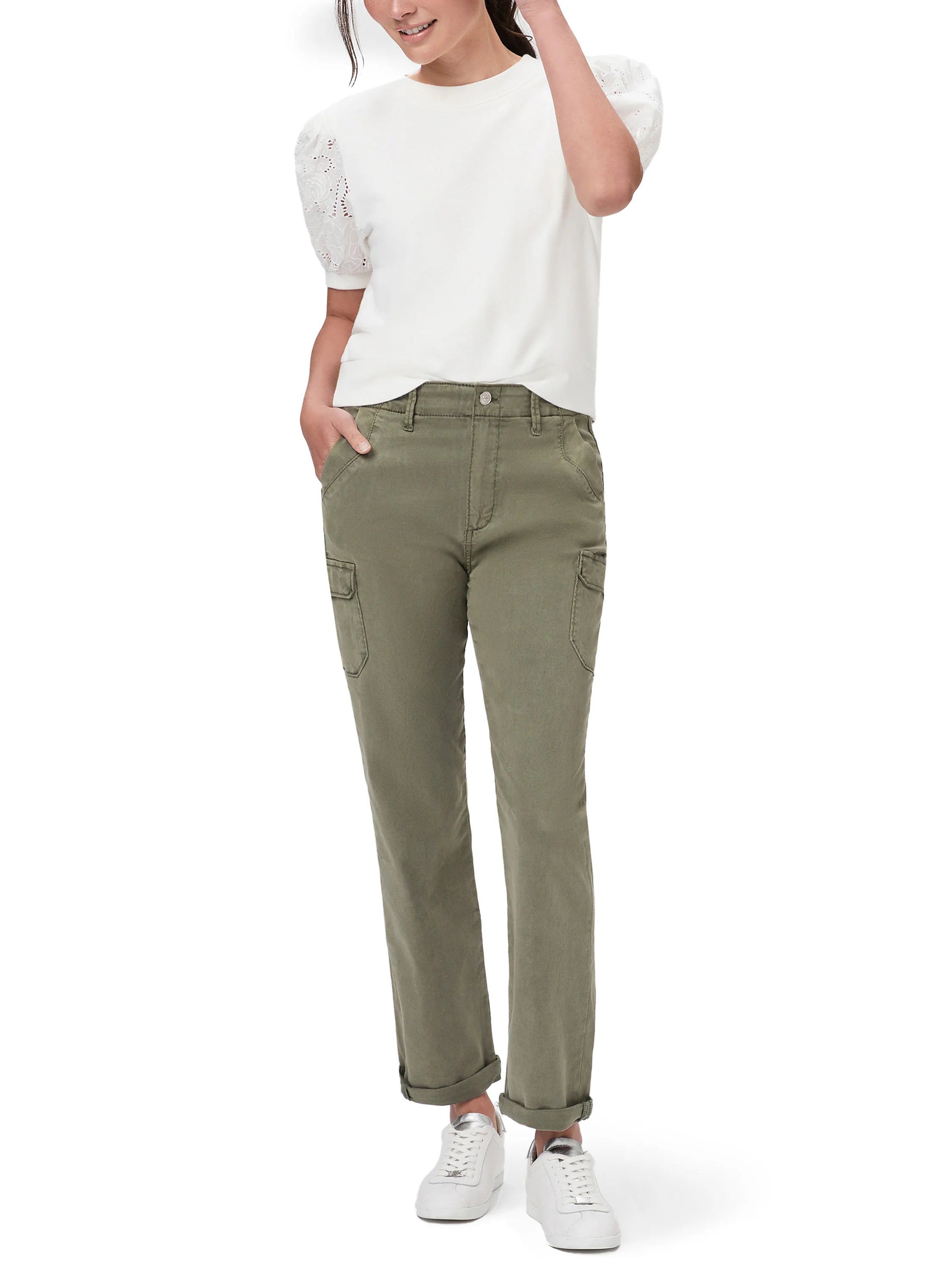 Olive green cargo pants with cuffed hems; model wears white top & sneakers.