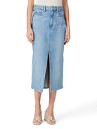Light blue denim midi skirt with a front slit.  The skirt is shown on a model.
