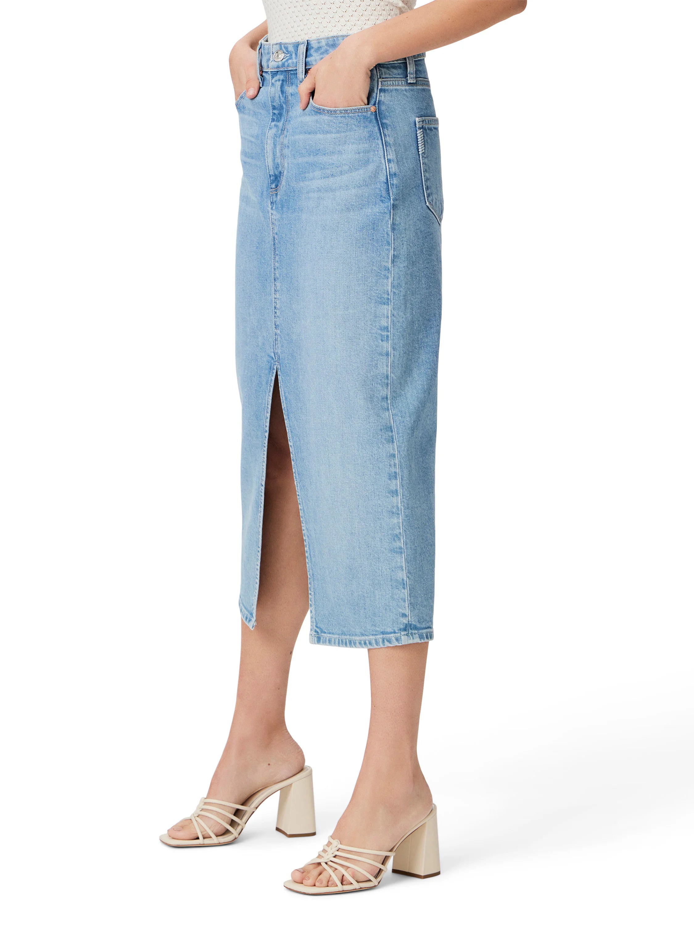 Light blue denim midi skirt with a front slit.  The model wears off-white heels.
