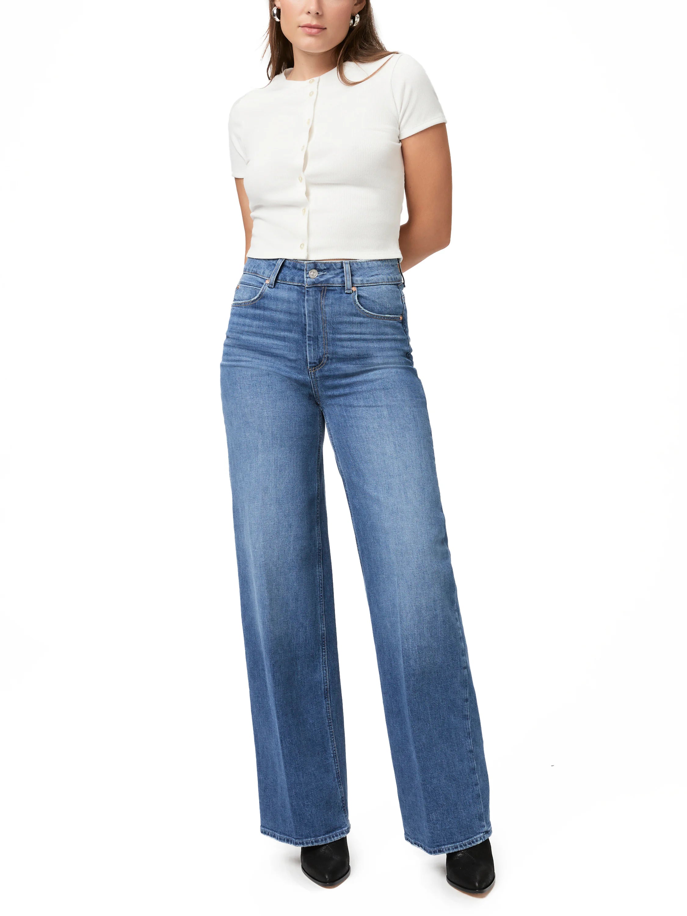 Paige Sasha jeans:  Light wash blue, wide-leg, high-waisted denim.  Model wears off-white top.