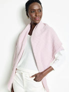 Light pink double gauze scarf; textured fabric; raw edges.