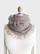 Taupe alpaca scarf with fringed edges. Shown draped on a light beige mannequin.