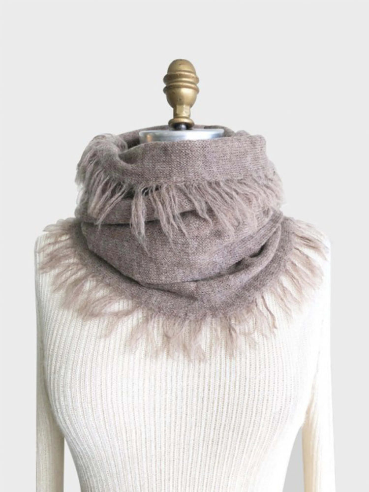 Taupe alpaca scarf with fringed edges. Shown draped on a light beige mannequin.