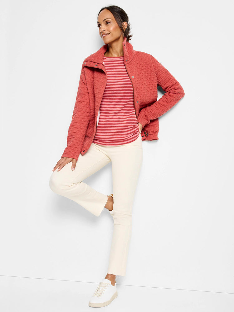 Dusty rose quilted jacket, snap closures.  Model wears it over a striped shirt.