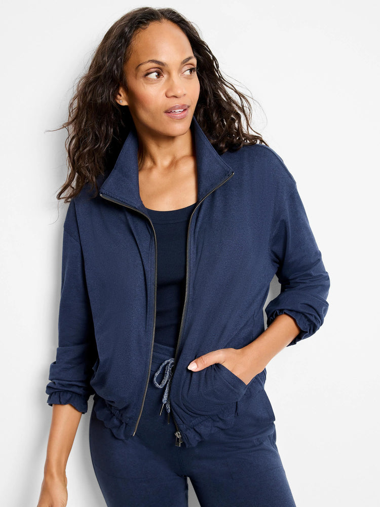 Navy blue zip-front jacket with slightly gathered cuffs and hem.  Features pockets and a drawstring waist.