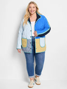 Quilted color-block coat in light blue, royal blue, yellow, grey, navy, teal trim. Features snap buttons and patch pockets.