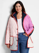 Quilted color-blocked coat: light pink, magenta, navy, grey, with red trim and snap buttons.