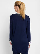 Navy blue cardigan, ribbed knit, long sleeves with off-white stripes at cuffs.