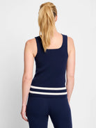 Navy blue ribbed knit tank top with off-white and gray stripes at the hem.  Sleeveless, square neckline.