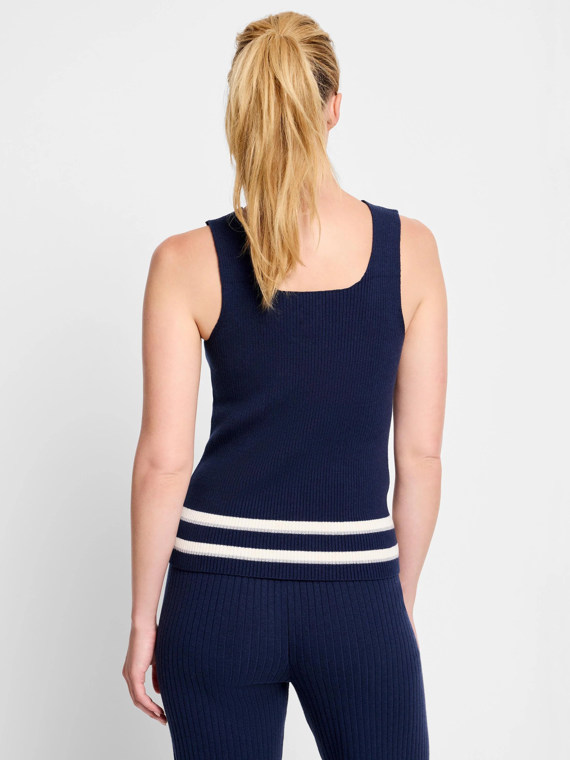 Navy blue ribbed knit tank top with off-white and gray stripes at the hem.  Sleeveless, square neckline.