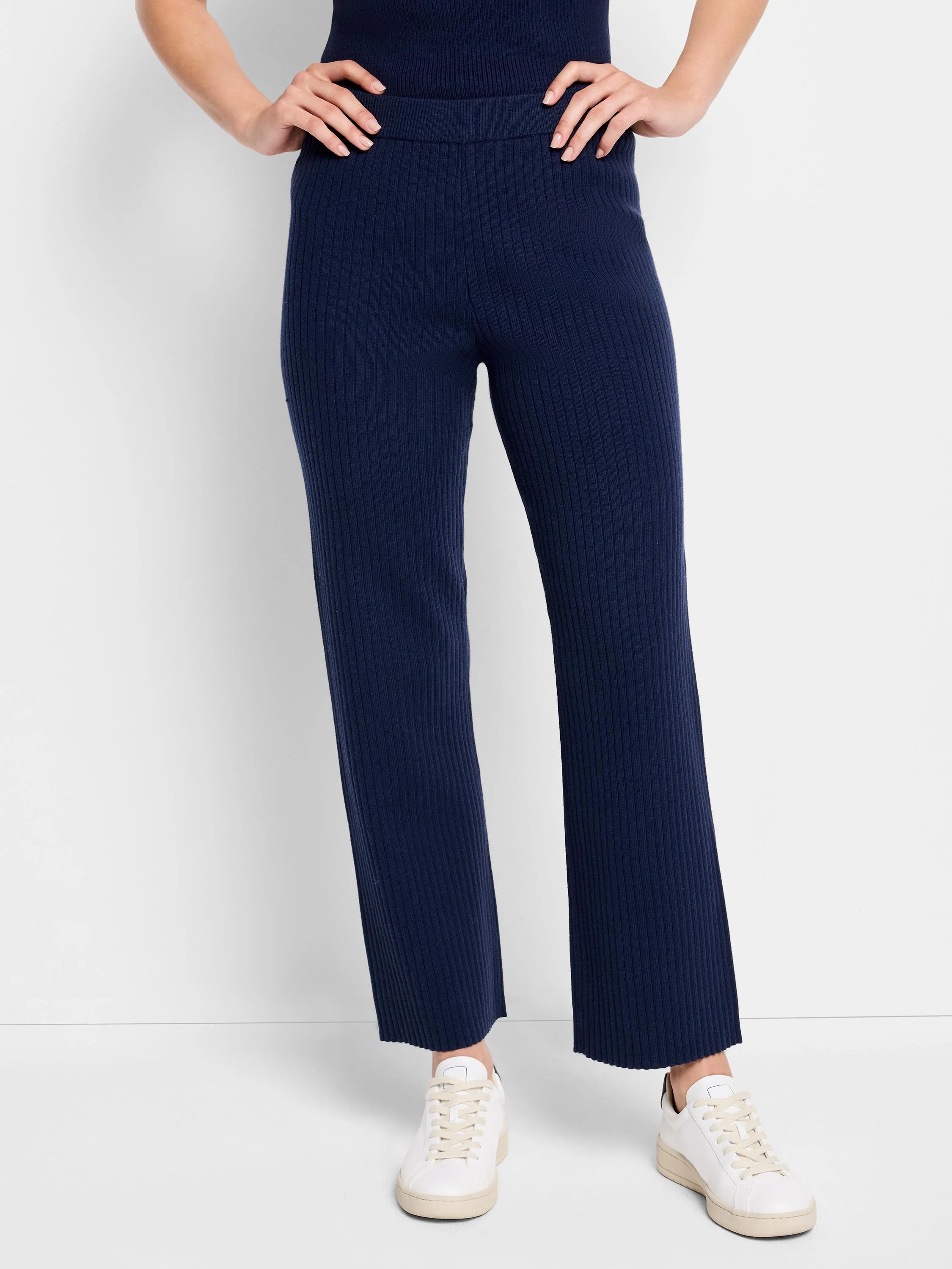 Navy blue ribbed knit pants; wide leg; raw hem.
