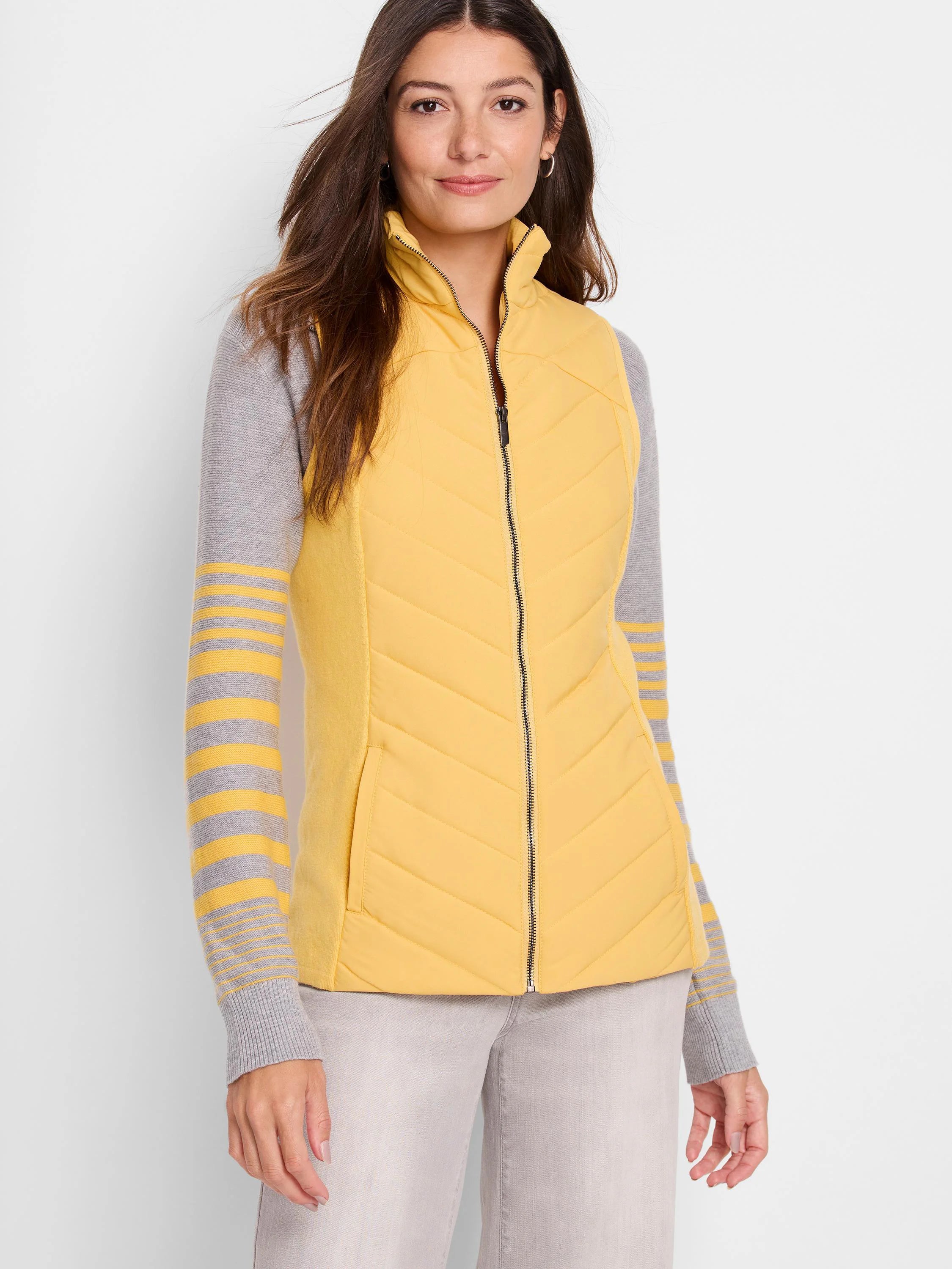 Mustard yellow quilted vest, front zipper, gray knit trim.  Sleeves shown are gray with yellow stripes.