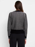 Gray textured zip-front cardigan with black and light gray stripes on the sleeves and shoulders. Black bottom band.