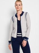 Zip-front light gray cardigan with navy and gray stripes at shoulders and cuffs.  Navy bottom trim.