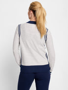 Here's alt text that meets the requirements:

Gray zip-front cardigan with navy blue stripes and trim.