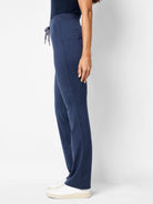 Here's alt text for the image, suitable for visually impaired users:

"Navy blue wide-leg pants, drawstring waist, side...