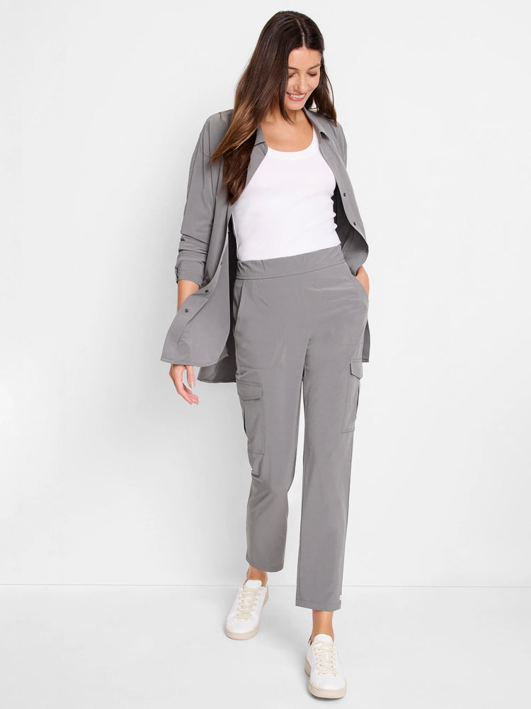 Gray long-sleeve Tech Stretch shirt with collar and button-down front. Shown unbuttoned over a white tank top.
