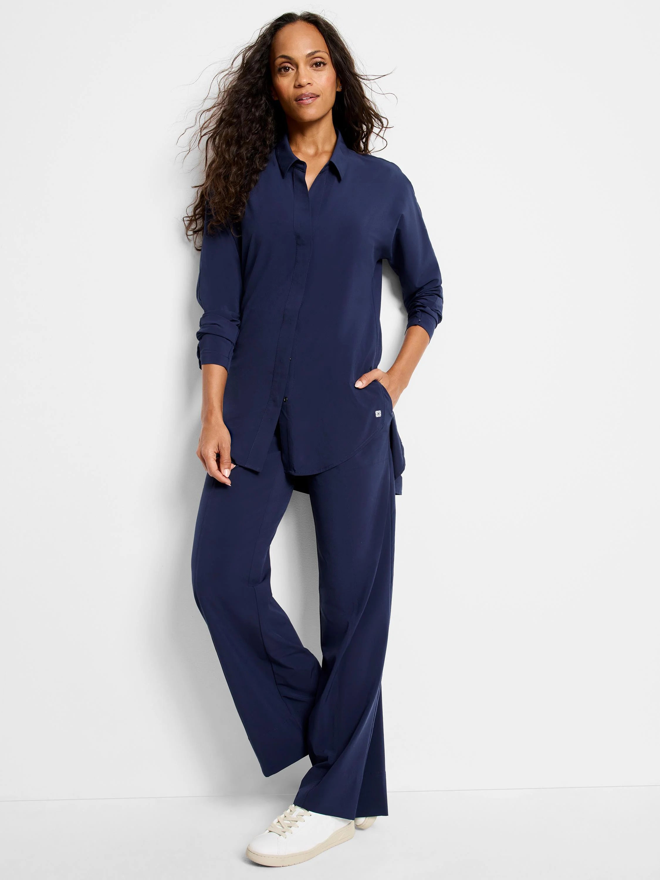 Navy Tech Stretch Shirt: collared, button-front, long sleeves, relaxed tunic length with side slits.