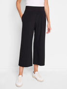 Black wide-leg cropped pants; elasticized waistband; side pockets; slight hem cuff.