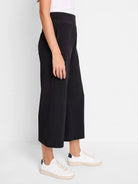 Black wide-leg cropped pants;  elastic waistband.