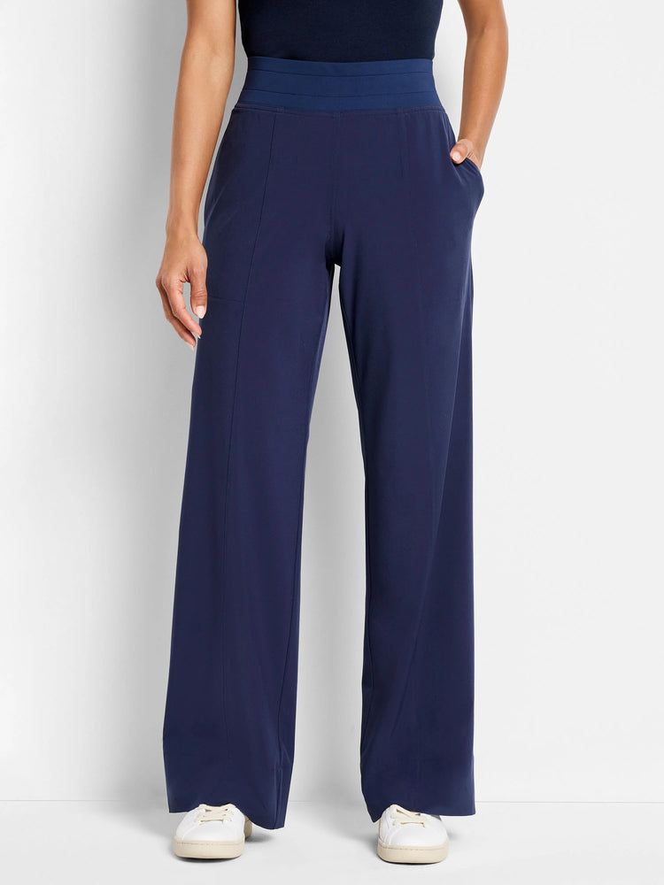 Navy blue wide-leg pants with a dark blue waistband and pockets.