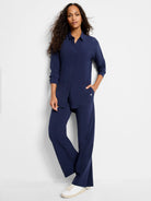 Navy blue wide-leg pants;  model wears matching navy blue top.  Pants have pockets.
