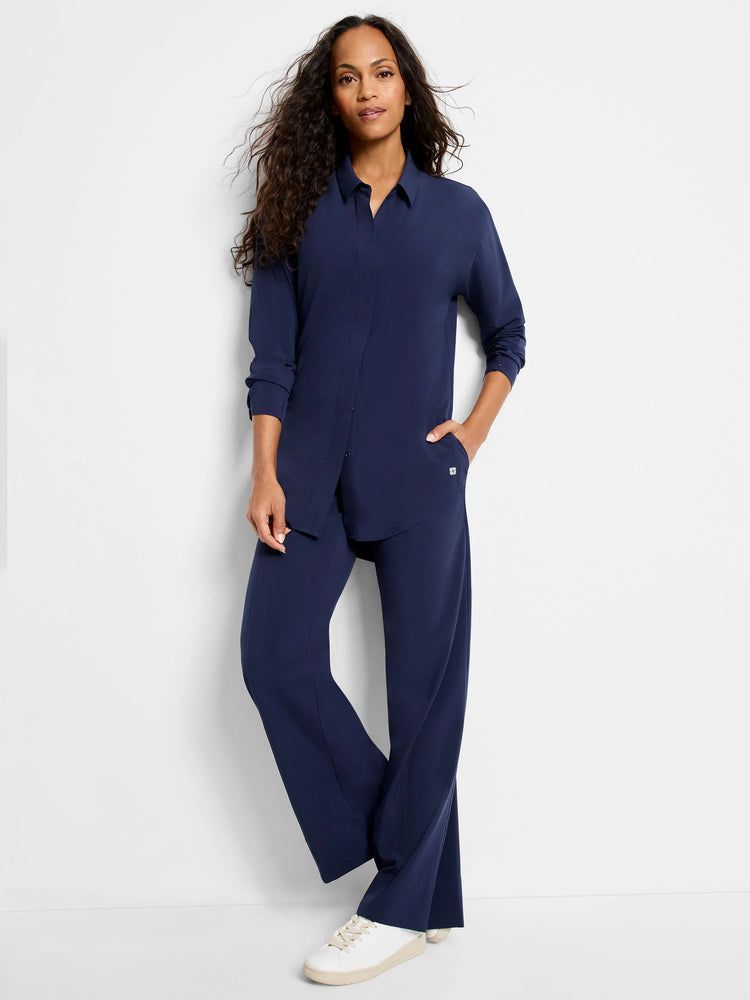 Navy blue wide-leg pants;  model wears matching navy blue top.  Pants have pockets.