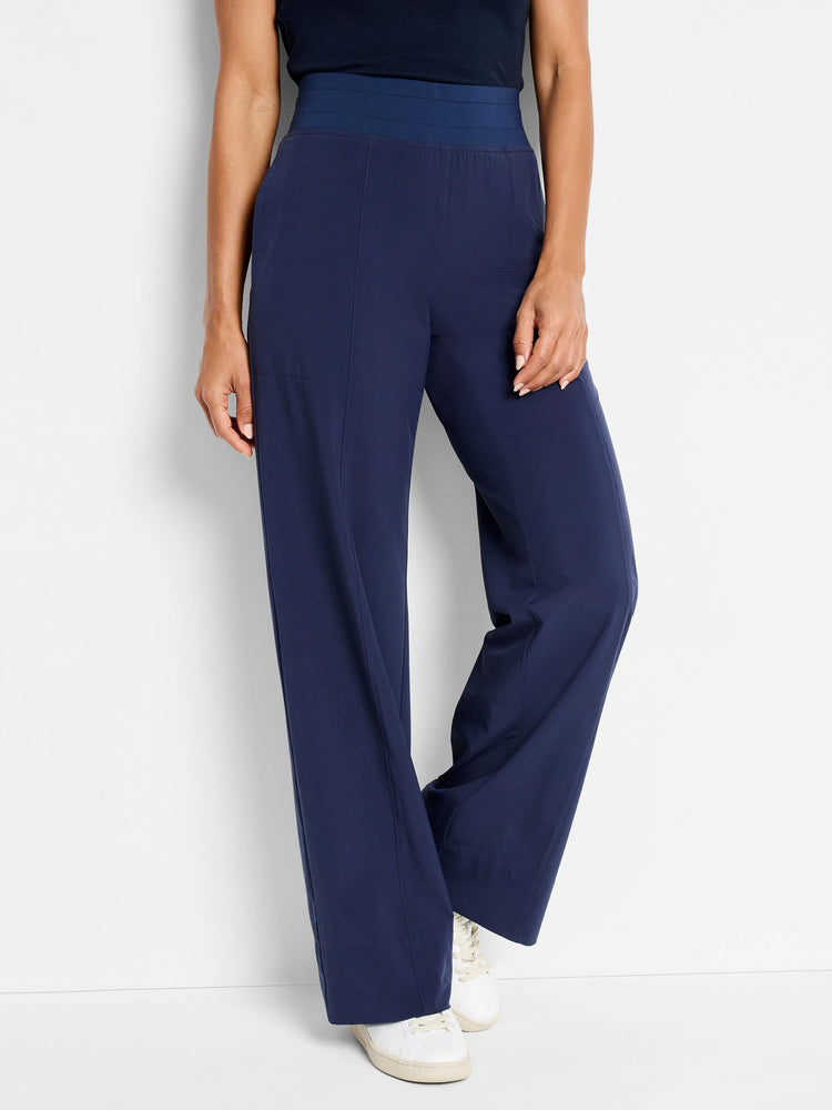Navy blue wide-leg pants with a dark navy elastic waistband.  Side pockets.