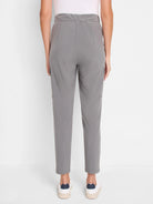 Grey cargo pants with elastic waist, side cargo pockets, and cropped length.