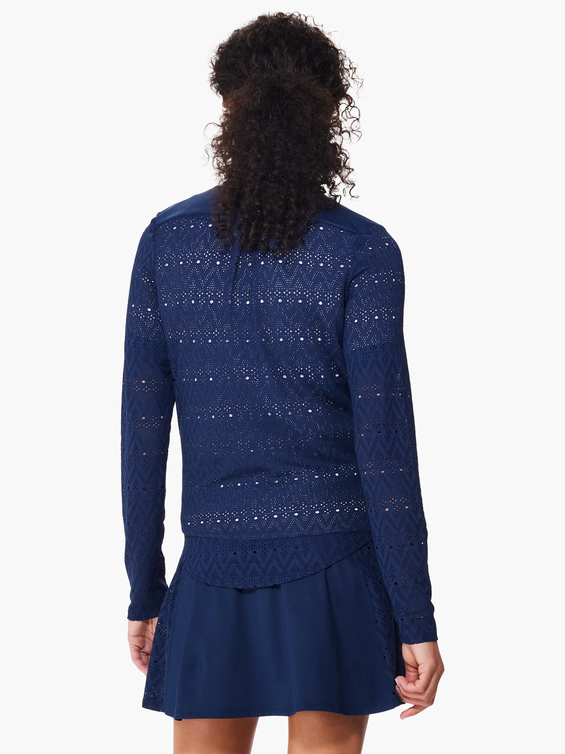 Navy blue long-sleeve jacket with a repeating geometric lace pattern.  The jacket is shown paired with a matching navy...