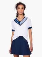 White v-neck sweater with navy and light blue stripes. Short sleeves, open knit.