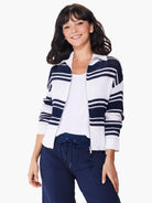 Zip-front sweater jacket; white and navy blue horizontal stripes; knit fabric.