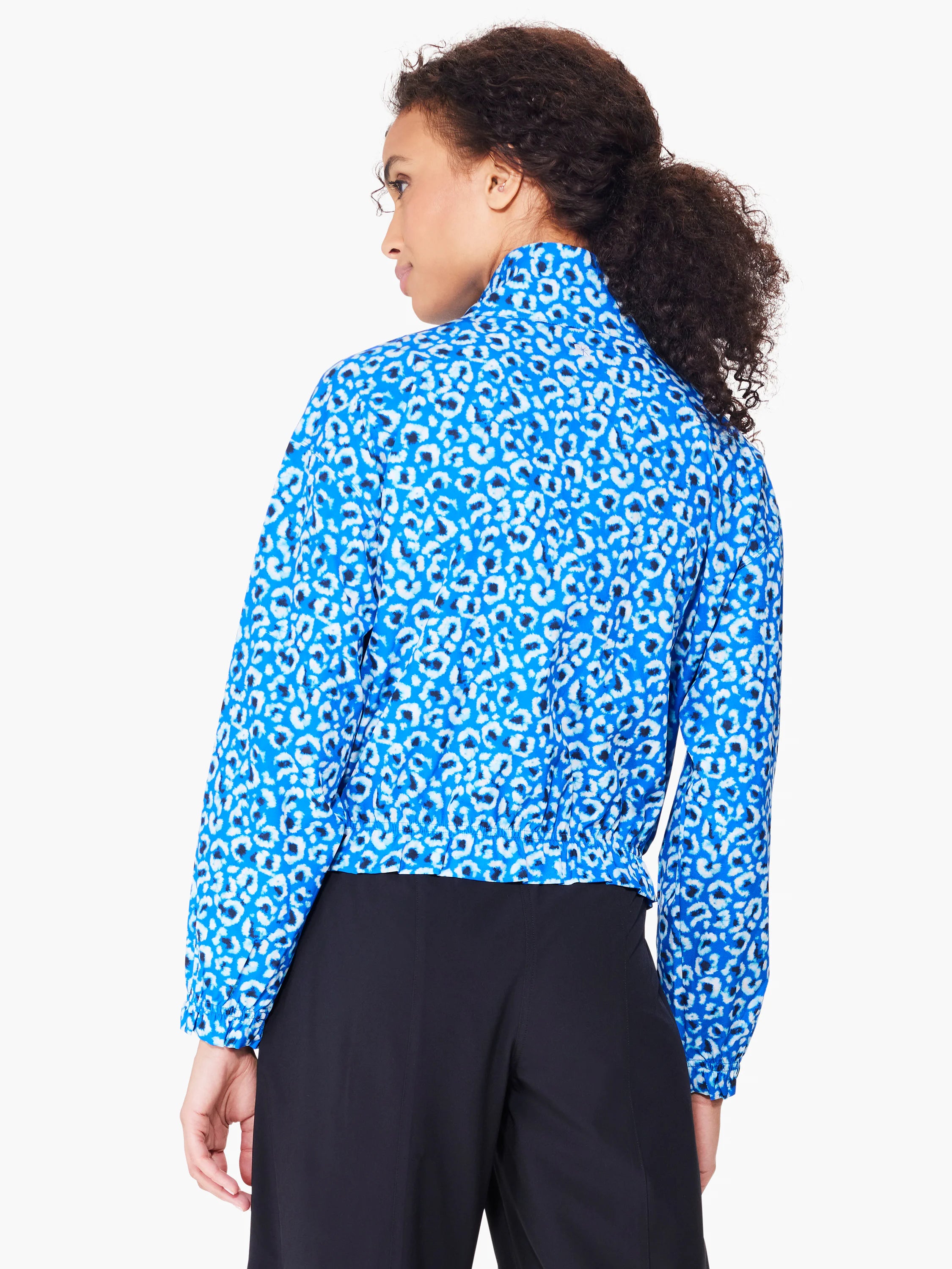 Blue jacket with white and dark blue leopard print.  Long sleeves, cropped length.