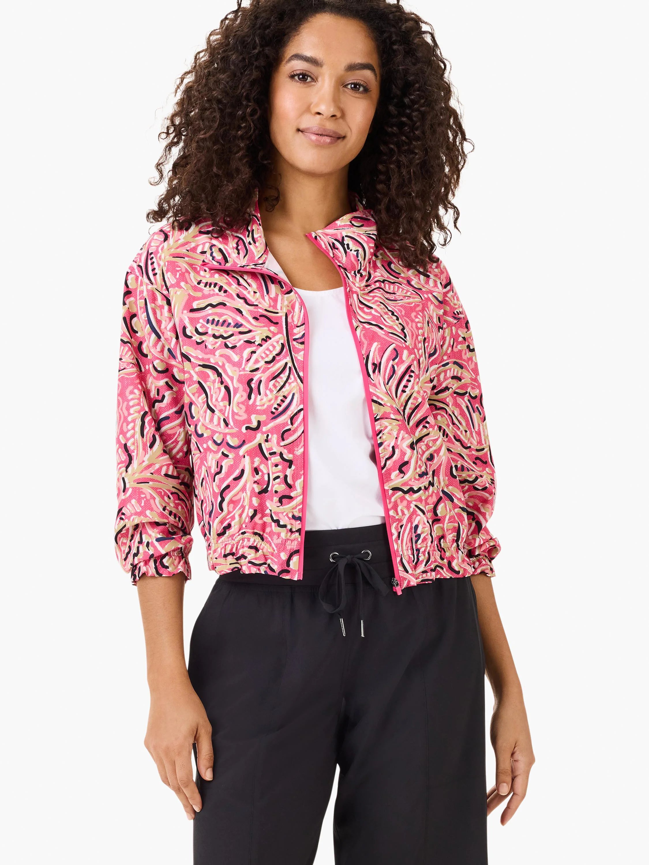 Pink jacket with a dark-pink, beige, and black floral pattern.  Zip front, elasticized cuffs.