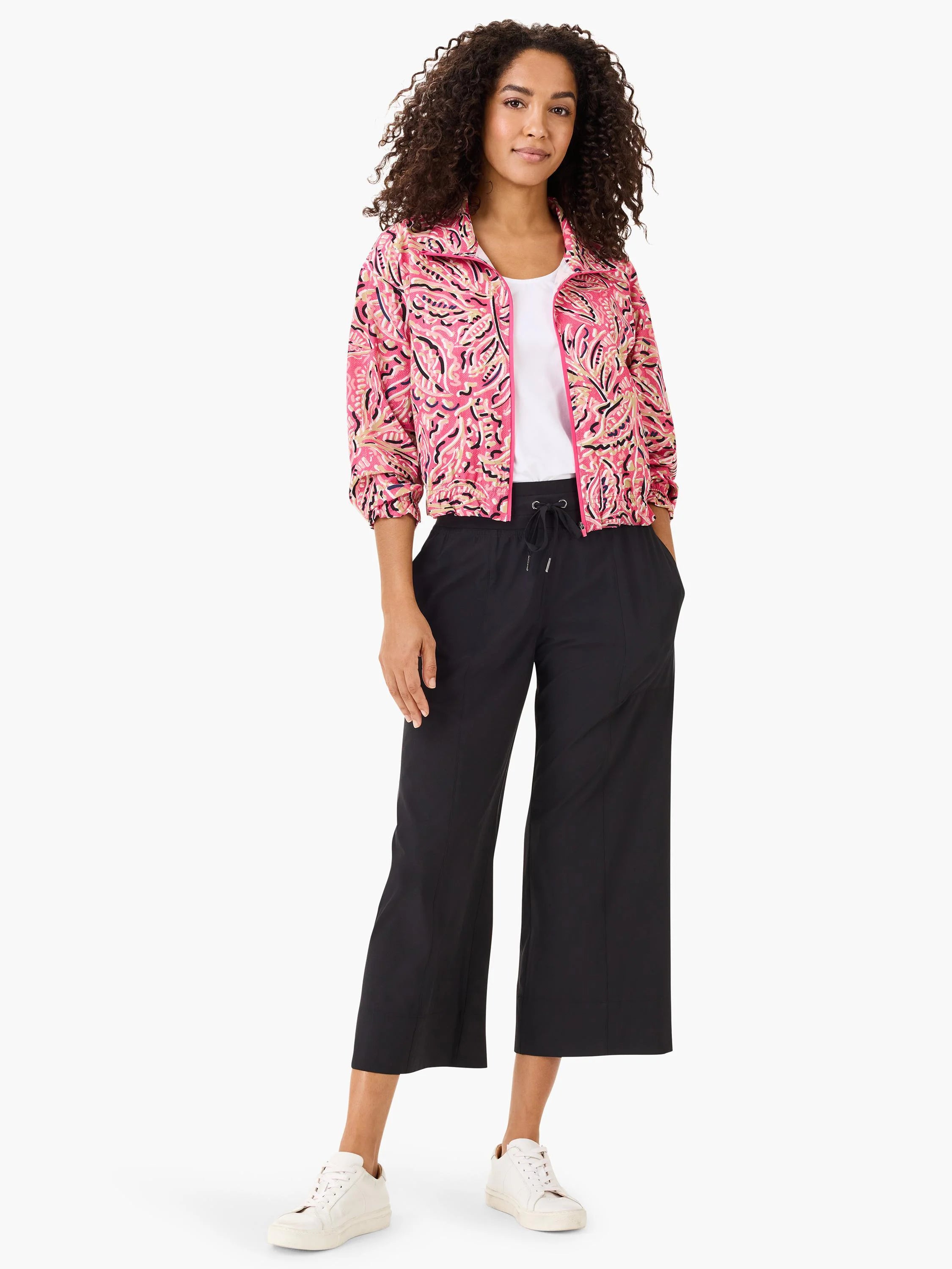 Pink jacket with a dark floral pattern, zip front, and cropped length.