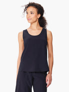 Black sleeveless shirt; scoop neck, seamed sides.  Model shown wearing matching black bottoms.