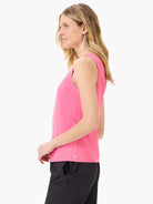 Pink sleeveless top, seamed detail, straight hemline. Small logo near hem.  Model shown wearing black bottoms.