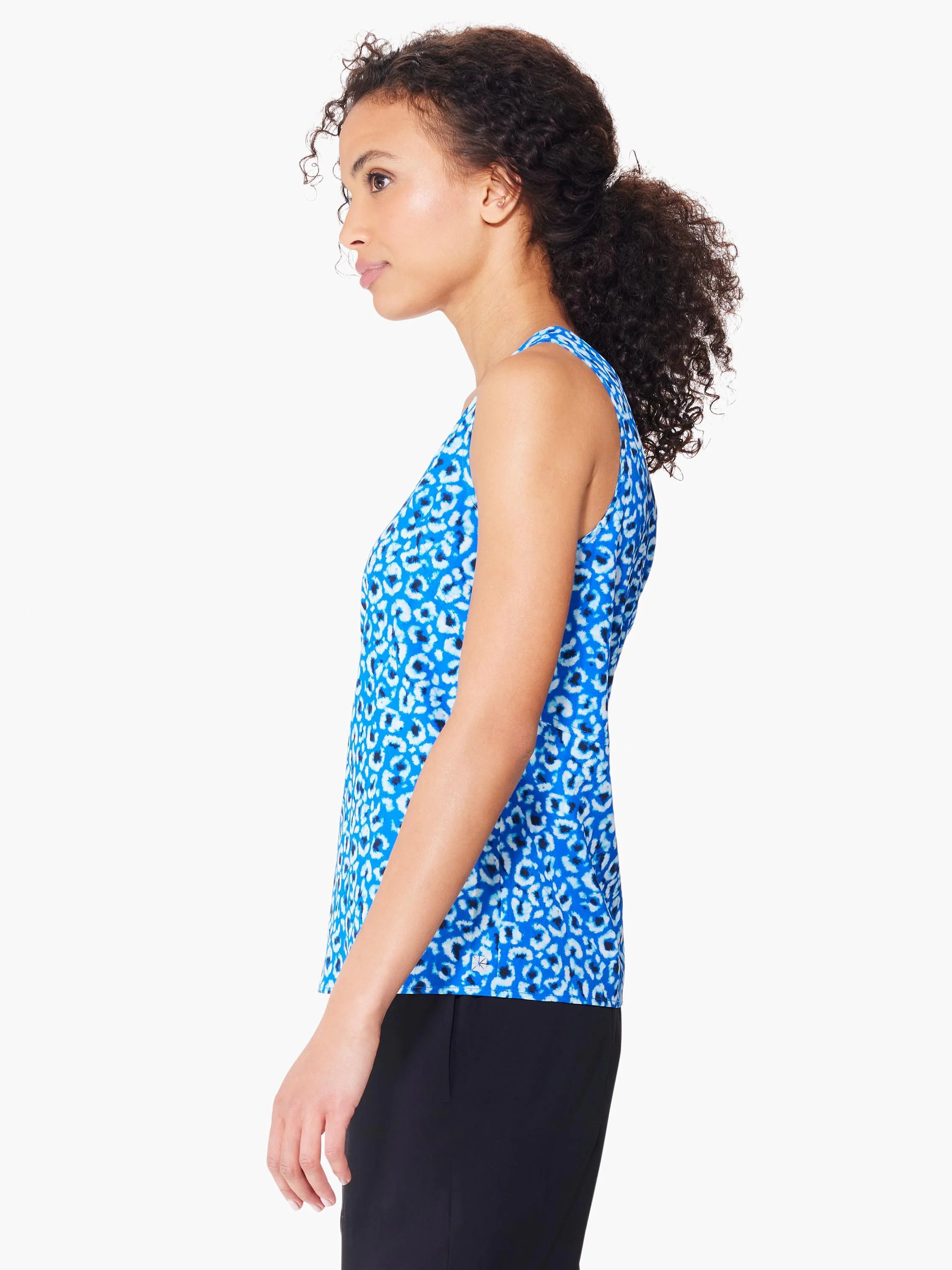 Blue sleeveless top with white and dark blue animal print.  Seamed detail.